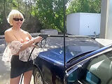 Beautiful blonde publicly plays with her pussy on carwash